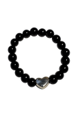 Black beaded bracelet with a silver heart charm on a white background